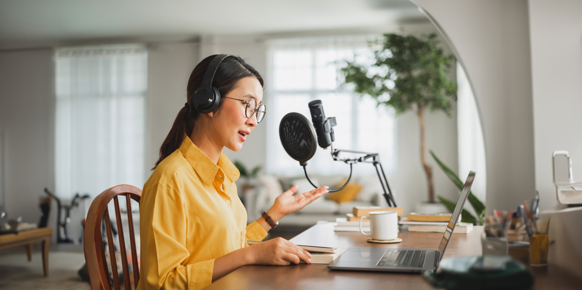 lady-with-microphone-headphone-in-front-of-laptop
